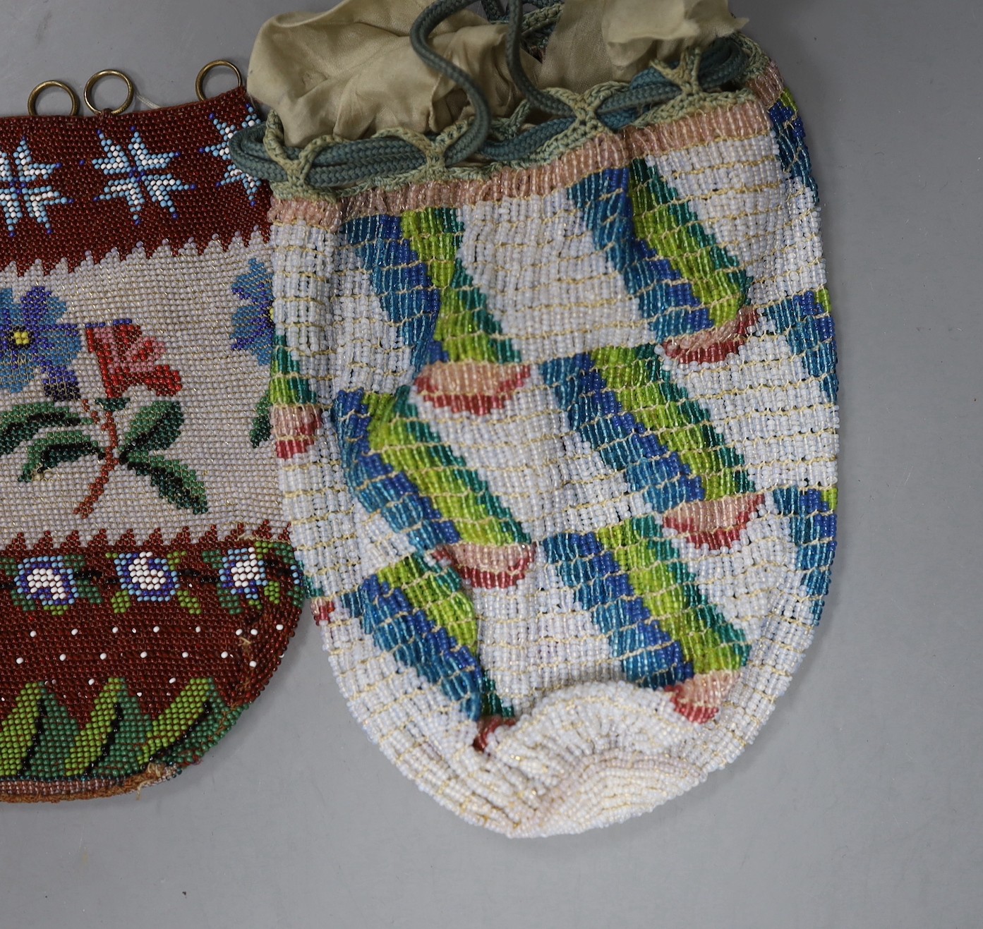A 19th century bead worked bag with sailing ship design, a similar floral bead worked bag and a 1920’s-30’s abstract bead worked bag